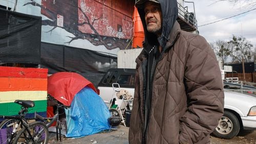 Will Bittler, who said he worked for decades as an electrician and has been homeless for about five months, stands near his tent behind a building on Cheshire Bridge Road in Atlanta on Friday, Dec. 29, 2023. (Natrice Miller/Atlanta Journal-Constitution/TNS)