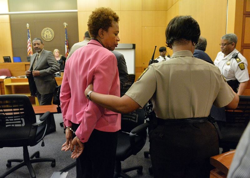 Former APS area superintendent Sharon Davis-Williams is led to a holding cell following her conviction.