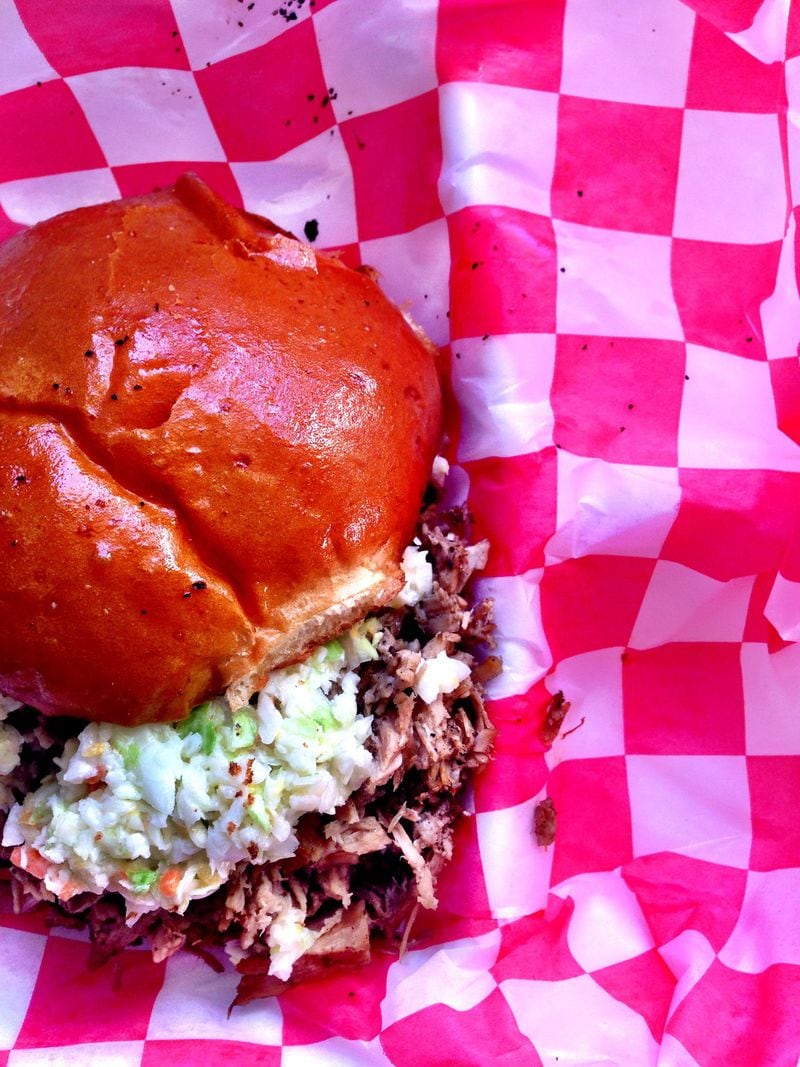The Carolina’s Finest sandwich is loaded with smoked whole hog, diced slaw, and vinegar sauce on an H&F bun. CONTRIBUTED BY WYATT WILLIAMS