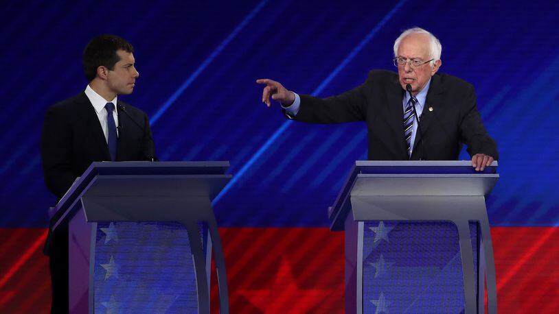 HOUSTON, TEXAS - SEPTEMBER 12: Democratic presidential candidates South Bend, Indiana Mayor Pete Buttigieg and Sen. Bernie Sanders (I-VT) interact during the Democratic Presidential Debate at Texas Southern University's Health and PE Center on September 12, 2019 in Houston, Texas. Ten Democratic presidential hopefuls were chosen from the larger field of candidates to participate in the debate hosted by ABC News in partnership with Univision. (Photo by Win McNamee/Getty Images)