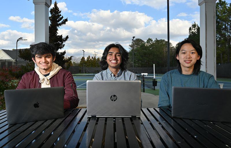 Three of the four co-founders of Ingenify, a free online tutoring website, (from left) Bedansh Pandey, 16, Paul Philip, 17, and Benson Zhang, 17, are shown in Suwanee on Wednesday, Feb. 10, 2021, at a neighborhood park where they often meet with their programmer and co-founder, Jatong Su, 17, (not pictured). (Hyosub Shin / Hyosub.Shin@ajc.com)
