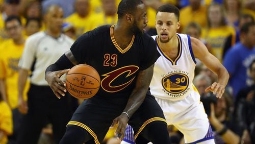 LeBron James of the Cleveland Cavaliers handles the ball against Stephen Curry of the Golden State Warriors during the second half in Game 7 of the 2016 NBA Finals at Oracle Arena on June 19, 2016 in Oakland, California. (Photo by Ezra Shaw/Getty Images)