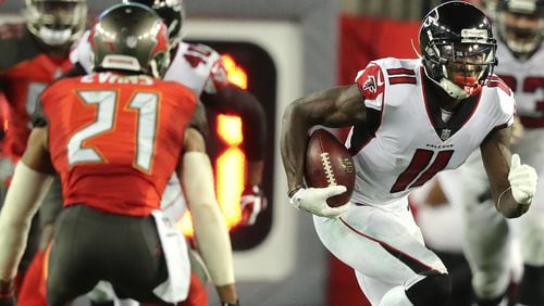 Falcons wide receiver Julio Jones makes a reception against the Buccaneers in a NFL football game on Monday, December 18, 2017, in Tampa.  Curtis Compton/ccompton@ajc.com