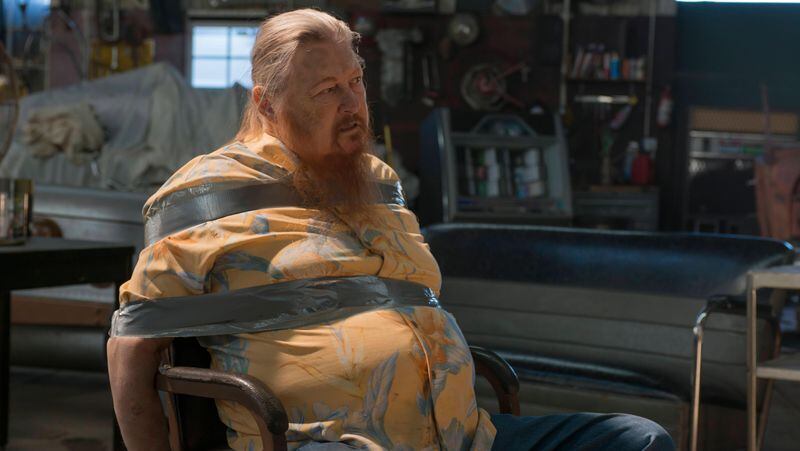 This image released by FX shows Mickey Jones as Rodney "Hot Rod" Dunham in a scene from "Justified." Jones, 76, a native of Houston, Texas, native, who worked steadily in TV and film since the 1970s, died early Wednesday of the effects of a long illness. The illness was not disclosed. 