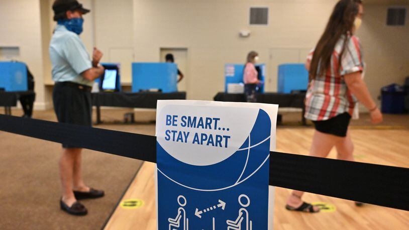 June 9, 2020 Norcross - Gwinnett County residents maintain social distancing cast their votes during the Georgia primary elections at Pinckneyville Community Center in Norcross on Tuesday, June 9, 2020. (Hyosub Shin / Hyosub.Shin@ajc.com)