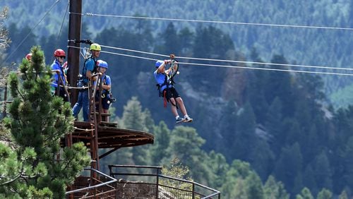 The newly opened Broadmoor Soaring Adventure zipline takes adventure seekers across a beautiful canyon and ends above Seven Falls. Jack Tanner zips from atop a rock formation on Thursday, August 13, 2015. (Jerilee Bennett/The Gazette)