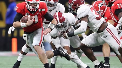 January 8, 2018 Atlanta: Jake Fromm runs for yardage on a quarterback keeper against Alabama during the first half in the College Football Playoff National Championship on Monday, January 8, 2018, in Atlanta.    Curtis Compton/ccompton@ajc.com