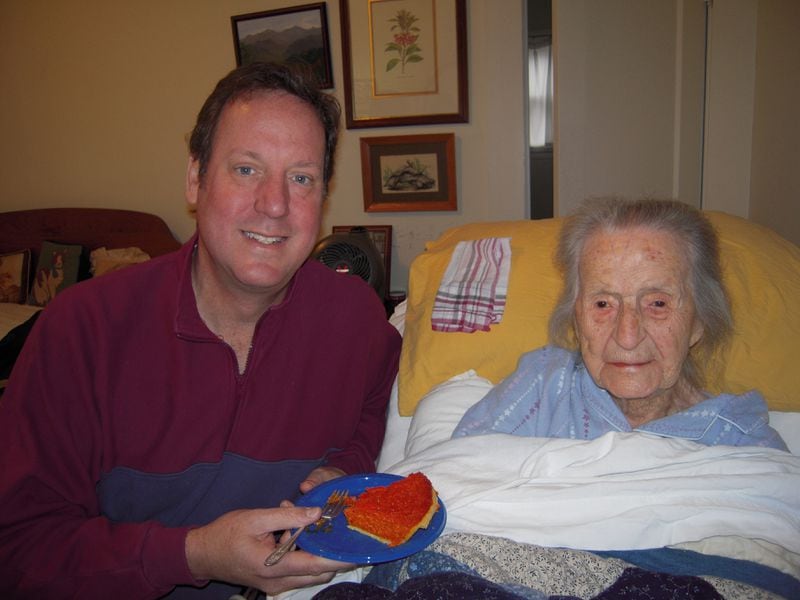 Leila Denmark and grandson Steve Hutcherson celebrate her 113th birthday with pie.