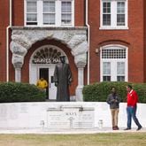 Morehouse College tour guide brings prospective students to the Benjamin E. Mays Memorial in front of Graves Hall  on the Morehouse College campus, Monday, March 18, 2024, in Atlanta. (Jason Getz / jason.getz@ajc.com)