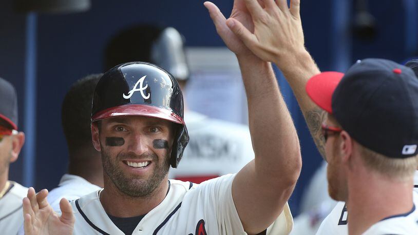 Jeff Francoeur accepts congratulations after scoring fro the Braves last May. (Curtis Compton / ccompton@ajc.com)