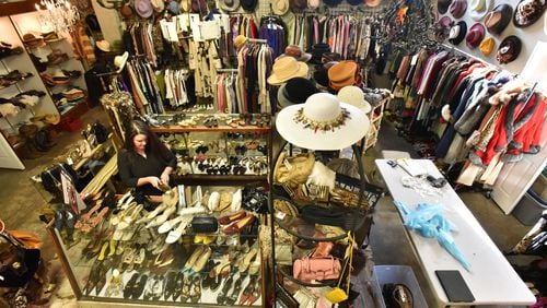 December 2, 2016 Atlanta - Christy Ogletree Ahlers, owner of Peachtree Battle Estate Sales and Liquidations, prepares for the estate sale of Diane McIver’s wardrobe next week as she is surrounded by more than 2,000 of Diane McIver’s clothing and jewelry items in a warehouse showroom at Peachtree Battle Estate Sales and Liquidations on Friday, December 2, 2016. More than 2000 of her articles of clothing, jewelry, hats and shoes are on display in his warehouse showroom. Tex McIver has enlisted an estate liquidation company to sell more than 2,000 of his deceased wife’s clothing and jewelry items. HYOSUB SHIN / HSHIN@AJC.COM