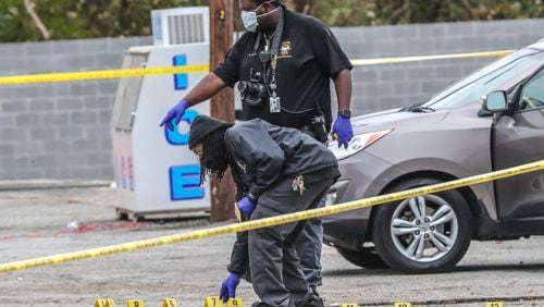 November 9, 2020 Atlanta: Atlanta police investigate the scene where a shootout outside a southwest Atlanta club Monday morning, Nov. 9, 2020 killed one man and injured a bystander who was caught in the crossfire, police said. Both victims were found in the parking lot of The Voo lounge on Campbellton Road near Childress Drive when officers arrived about 6:30 a.m. According to Atlanta police Lt. Pete Malecki, clubgoers scattered when first responders got on scene. “At this point, we don’t have any witnesses that have come forward and provided information,” he told AJC.com. “But what we are gathering is there was some kind of shootout, and we know that our surviving victim was caught up in that crossfire when he was injured.” That victim, described as a 28-year-old man, was taken to a hospital in an ambulance and was expected to survive, Malecki said. The other man, who appeared to be in his late 20s or early 30s, was dead at the scene. He has not been identified. Malecki, who heads APD’s homicide unit, said he is hopeful the surviving victim will be able to shed some light on what happened once he is out of surgery. While they believe the club was open at the time of the shooting, Malecki said none of the employees or management stuck around to speak with investigators. A handgun and 15 spent shell casings were recovered at the scene, he said. Anyone with information on Monday morning’s deadly incident is asked to come forward. Tipsters can remain anonymous, and be eligible for rewards of up to $2,000, by contacting Crime Stoppers Atlanta at 404-577-8477, texting information to 274637 or visiting the Crime Stoppers website. (John Spink / John.Spink@ajc.com)

