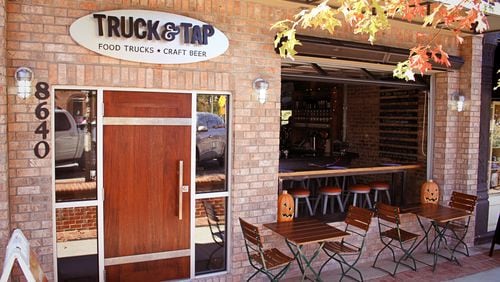 Operable garage bay doors allow for fresh air and people watching at Truck & Tap in Woodstock. Photo by Jennifer Carter.