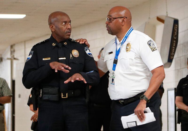 Savannah Police Chief Roy Minter talks with Savannah Chatham County Public Schools Campus Police Chief Terry Enoch during an active shooter drill.