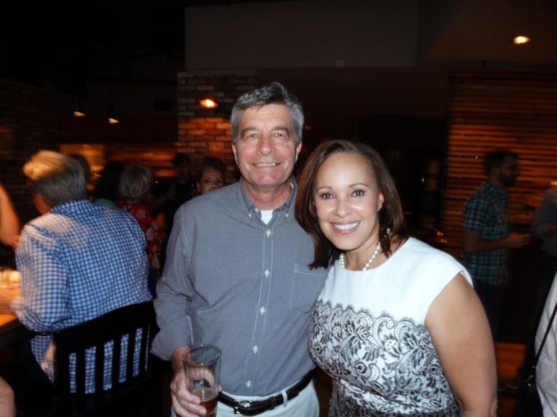 Kevin Rowson with Brenda Wood at an 11 Alive going away party for those who took the buyout this spring. CREDIT: Rodney Ho/ rho@ajc.com