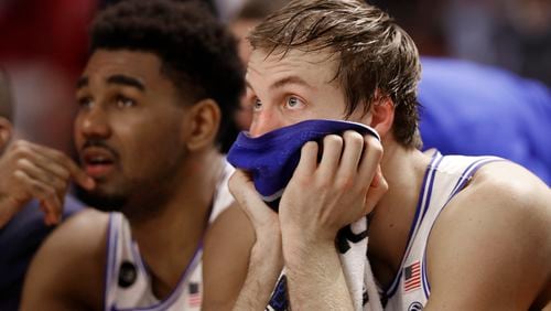 Duke's Luke Kennard, right, watches the final minutes from the bench after fouling out during the second half of Sunday's tournament loss to South Carolina. (AP Photo/Chuck Burton)