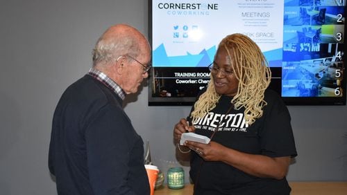 Cheryle Moses greets attendee Niall Mathieson at the first Come Meet a Black Person networking event held in November. Contributed