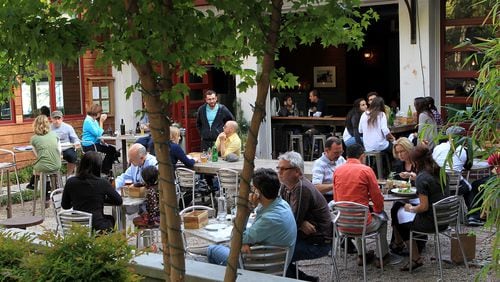 Patio dining: Spring is a great time to eat outside, like these patrons of Leon's Full Service in Decatur.