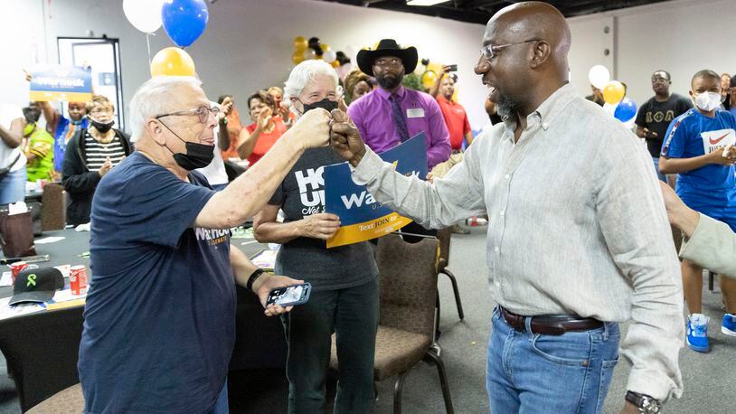 Senator Raphael Warnock greats the crowd during a rally in Atlanta, GA, on Saturday, July 23, 2022.  on Saturday, July 23, 2022.   (Bob Andres for the Atlanta Journal Constitution)