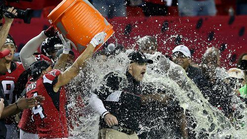 Falcons head coach Dan Quinn has Gatorade dumped on him by his team late in the game against the Green Bay Packers in the NFC Championship Game at the Georgia Dome on January 22, 2017 in Atlanta, Georgia. (Streeter Lecka/Getty Images)
