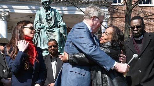 Lynne Jackson, right, great great granddaughter of Dred Scott, hugs Charles Taney III, a descendant of U.S. Supreme Court Chief Justice Roger Taney, after their reconciliation. On left, is Charles Taney's daughter Kate Taney-Billingsley, who wrote a play of a fictional meeting of the descendants, which created the opportunity for the actual meeting. (Kenneth K. Lam/Baltimore Sun/TNS)