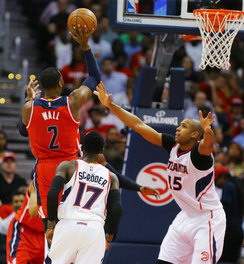 051315 ATLANTA: Wizards John Wall shoots for two points over Hawks Al Horford in their Eastern Conference Semifinals game 5 on Tuesday, May 13, 2015, in Atlanta. Curtis Compton / ccompton@ajc.com