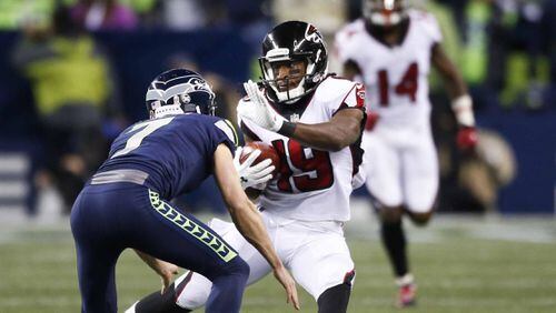 Kicker Blair Walsh of the Seattle Seahawks tries to block wide receiver Andre Roberts of the Atlanta Falcons on the opening kickoff in the first quarter of the game at CenturyLink Field on November 20, 2017 in Seattle, Washington.  (Photo by Otto Greule Jr /Getty Images)