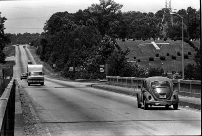 A Volkswagen heads north into what was then semi-rural Cobb County on the South Cobb Drive bridge over the Chattahoochee River. It was on this bridge that Wayne Williams was sighted the night of May 22, 1981 - the event that eventually led to his arrest in the murder of Nathaniel Cater.