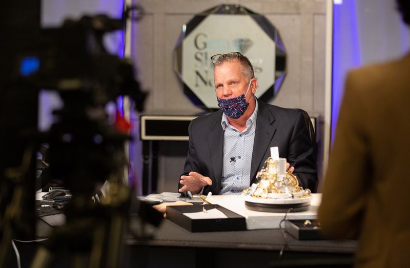 Gem Shopping Network on-air host Kurt Schneider talks with his viewers in their Duluth studio on November 16, 2020.  STEVE SCHAEFER / SPECIAL TO THE AJC 