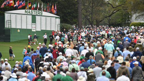Spectators leave after play was suspended because of approaching inclement weather during a practice round for the Masters at Augusta National Golf Club on Tuesday, April 5, 2022, in Augusta. (Hyosub Shin / Hyosub.Shin@ajc.com)