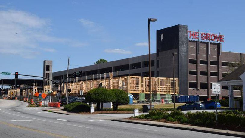 Wood frames are rising out of the ground for the last batch of luxury apartments to begin construction around the parking deck at Snellville's The Grove at Towne Center development. (Courtesy of Curt Yeomans)