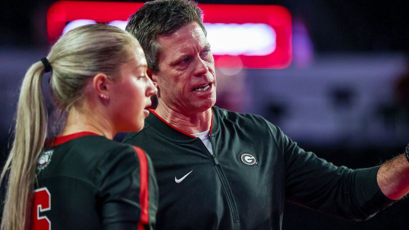 Georgia volleyball coach Tom Black offers instructions to Alexa Fortin during the Bulldogs' match earlier this season against Ole Miss. Black recently was named SEC Coach of the Year. (Photo by Tony Walsh/UGA Athletics)
