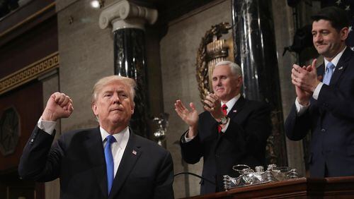 President Donald Trump gestures as he finishes his first State of the Union address in the House chamber of the U.S. Capitol to a joint session of Congress Tuesday, Jan. 30, 2018 in Washington, as Vice President Mike Pence and House Speaker Paul Ryan applaud. (Win McNamee/Pool via AP)