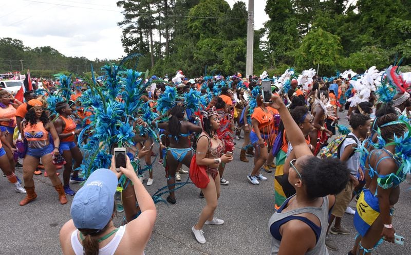 May 27, 2017 Decatur - Parade participants march down Covington Highway during Atlanta Caribbean Carnival Parade in Decatur in 2017 HYOSUB SHIN / HSHIN@AJC.COM