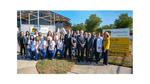 Leaders from Reinhardt University and Chattahoochee Technical College and Reinhardt nursing students celebrate an agreement that eases the way for Chattahoochee Tech students to seek four-year nursing degrees at Reinhardt. BILL BLOUNT/CHATTAHOOCHEE TECH