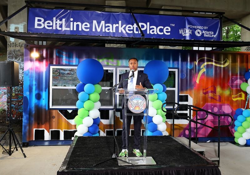 071322 Atlanta: Atlanta BeltLine, Inc.'s President & CEO Clyde Higgs speaks during the opening of the inaugural BeltLine MarketPlace under the Freedom Parkway Bridge, on Wednesday, July 13, 2022, in Atlanta. The new pilot program offers pop-up storefront space for local, Black-owned businesses in refurbished shipping containers along the Atlanta BeltLine in two different areas.  “Curtis Compton / Curtis Compton@ajc.com”