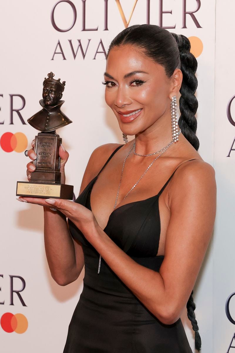 Nicole Scherzinger, winner of the best actress in a musical award for "Sunset Boulevard", poses for photographers in the winner's room during the Olivier Awards on Sunday, April 14, 2024, in London. (Photo by Vianney Le Caer/Invision/AP)
