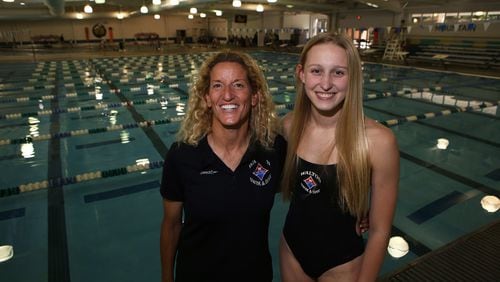 Emma Cole (right) and her head coach Sharon Loughran at the Mountain View Aquatic Center in Marietta on May 10, 2017. In addition to her swim team taking first place in the 400m freestyle relay at the state championships, beating their previous record, Cole won first in both the 100 free and 200 free. She will attend the University of North Carolina in the fall after swimming year-round since she was 8 years old. (Henry Taylor / Henry.Taylor@AJC.com)