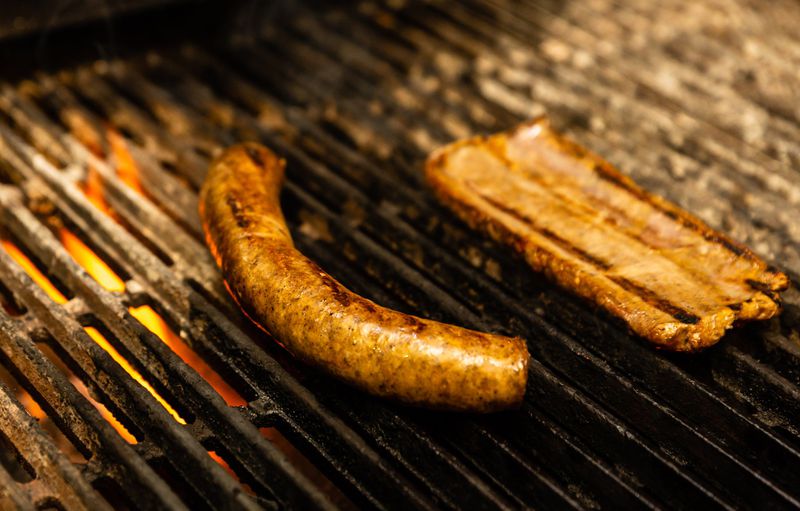 At 10 Degrees South, one boerewors sausage is grilled whole (left), while the other is split for a sandwich. CONTRIBUTED BY HENRI HOLLIS