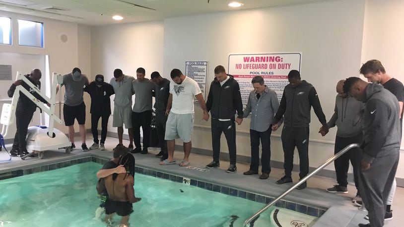 Philadelphia Eagles wide receiver Marcus Johnson was baptized in a pool before Thursday night's game against the Carolina Panthers.