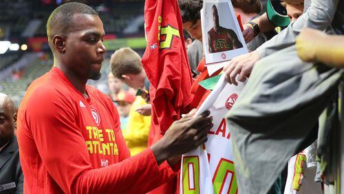 Atlanta Hawks Paul Millsap signs dozens of autographs before playing the Wizards in Game 3 of a first-round NBA basketball playoff series on Saturday, April 22, 2017, in Atlanta. Curtis Compton/ccompton@ajc.com