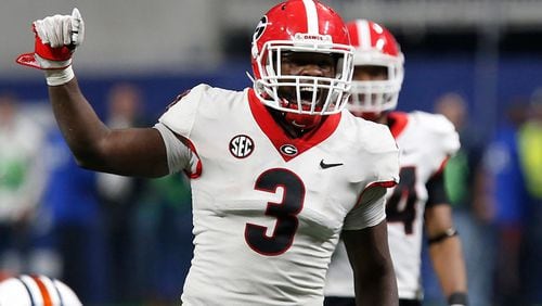Georgia linebacker Roquan Smith (3) yells out commands before Auburn runs a play during the SEC title game in Atlanta.