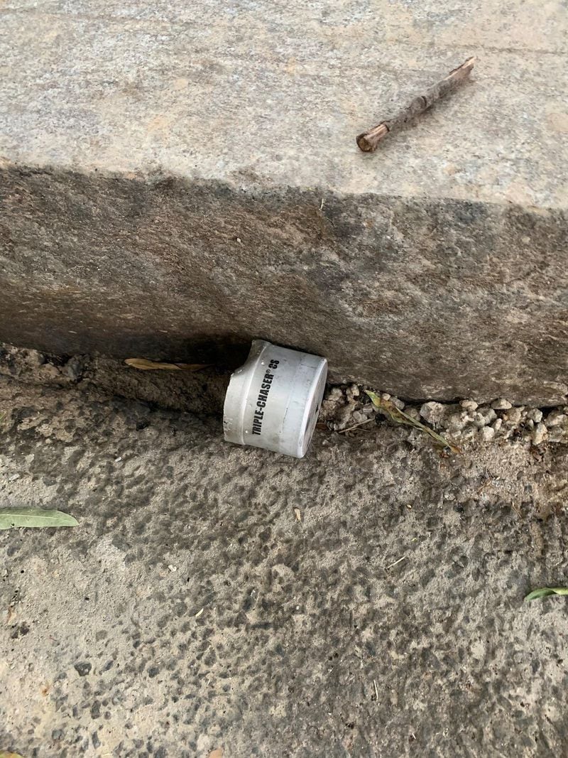 A spent canister of tear gas, fired at protesters outside the state Capitol on Tuesday. The canister’s manufacturer says it emits chemicals known to cause cancer and birth defects. A protester photographed the canister after police dispersed demonstrators.