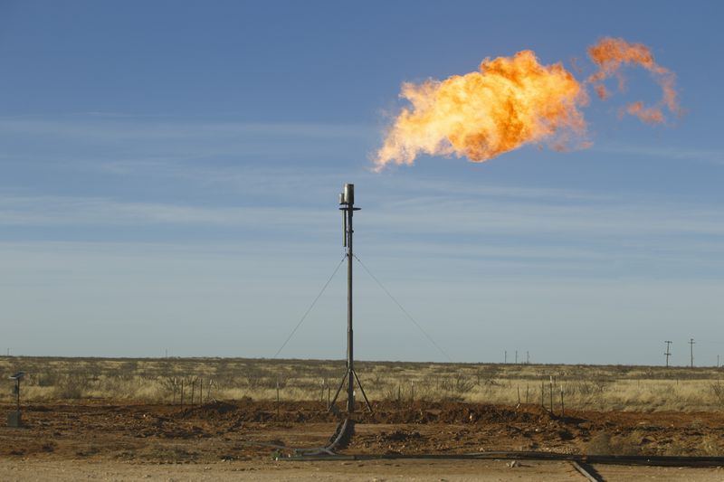 Natural gas being flared at well site north of Odessa, Texas, Jan. 29, 2016. (Michael Stravato/The New York Times)
