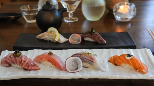Selection of seared and fresh nigiri including Sake (fresh salmon with aioli sauce, truffle soy, black pepper and caviar), Hamachi, Kampachi, and Shima aji at MF Sushi. (Becky Stein Photography)