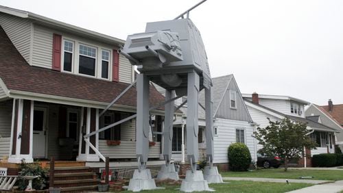 Nick Meyer used wood, hard foam and plastic barrels to create an AT-AT walker in his yard. Contributed by Patrick Cooley/The Plain Dealer-Cleveland.com via AP
