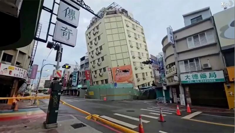 In this image from a video, roads in Hualien, Taiwan are cordoned off after a cluster of earthquakes struck the island early Tuesday, April 23, 2024. There were no reports of casualties in the quakes, although there were further damages to two multi-story buildings that had been evacuated following a magnitude 7.4 quake that hit the island earlier this month, killing 13 people and injuring over 1,000. (TVBS via AP)