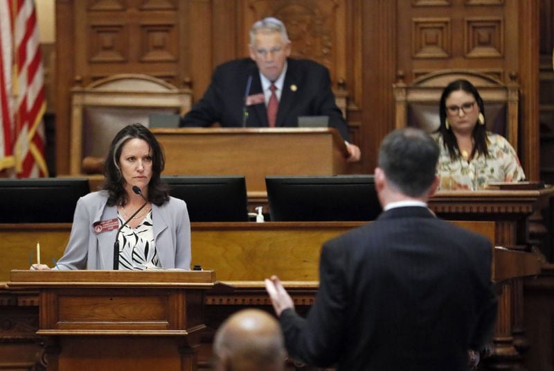 Evans Republican state Rep. Jodi Lott, Gov. Brian Kemp’s floor leader, responds to questions from House Minority Leader Robert Trammell, D-Luthersville, while presenting Senate Bill 106. The measure, which would allow the governor to pursue health care waivers from the federal government, passed mostly along party lines in 104-67 vote. Bob Andres / bandres@ajc.com