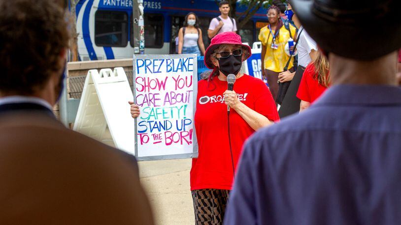 Georgia State University professor Wendy Simonds talks to the crowd during a protest for stronger COVID-19 safety protocols  Monday, August 30, 2021. STEVE SCHAEFER FOR THE ATLANTA JOURNAL-CONSTITUTION