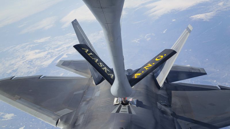 In this photo provided by the Alaska National Guard, an F-22 Raptor fighter jet hooks up to an Alaska Air National Guard KC-135 Stratotanker, from the 168th Air Refueling Wing, to conduct in-air refueling over the Joint Pacific Alaska Range Complex during their fighter/bomber exercises, May 1, 2014. Personnel changes implemented at the national level may hinder the Alaska Air National Guard's ability to refuel U.S. and Canadian fighter jets when they scramble to escort Russian bombers nearing North American air space. (Lt. Bernie Kale/Alaska National Guard via AP)